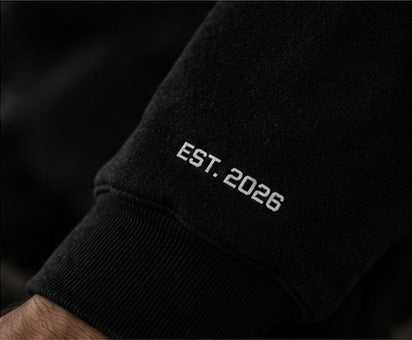EST. 2026 print on the sleeve of the GRIPT FW26 hoodie